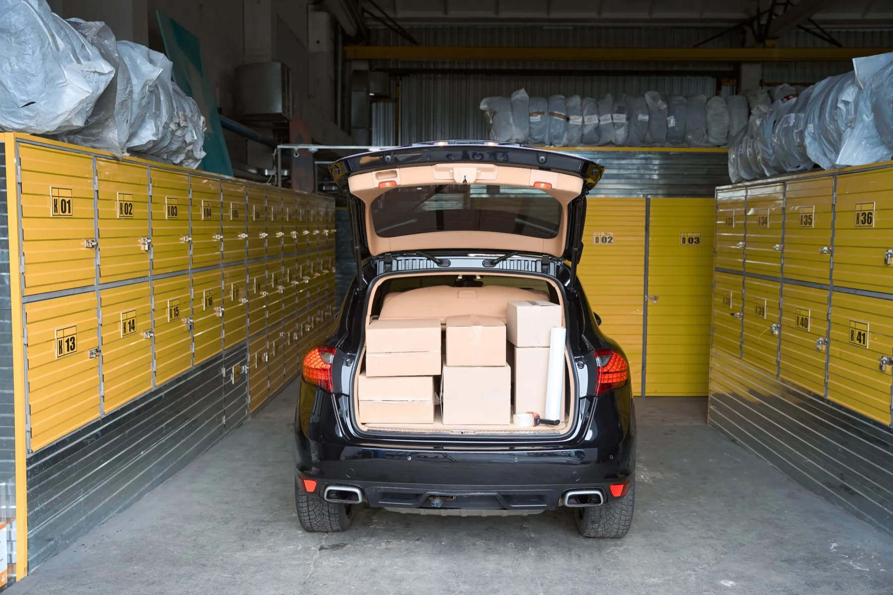 A car with its boot packed with boxes