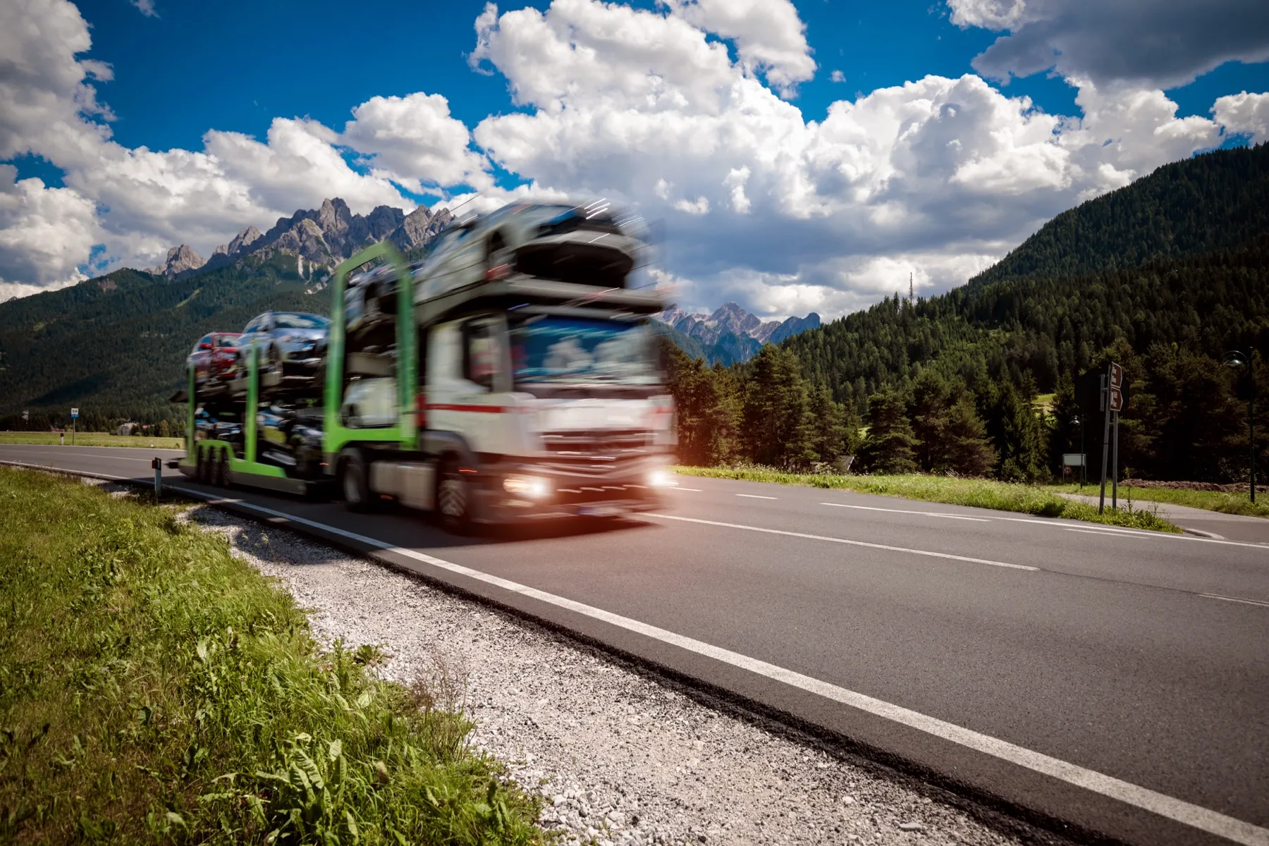 A car transporter lorry on a mountain road